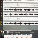 Close-up of an audio editing software interface showing sound wave patterns.